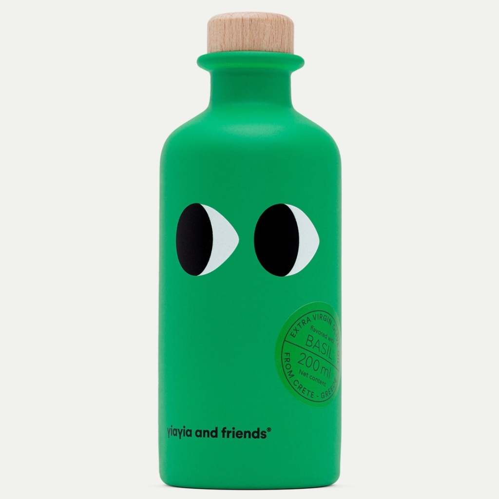 Vibrant green bottle of basil infused extra virgin olive oil 200ml with wooden stopper.