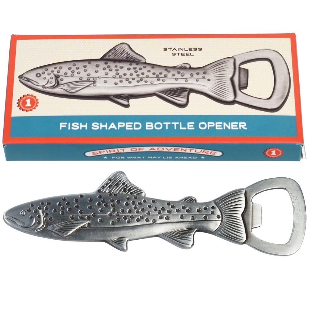 A silver stainless steel bottle opener shaped like a spotted trout fish, displayed next to its retro blue and red illustrated cardboard packaging box.