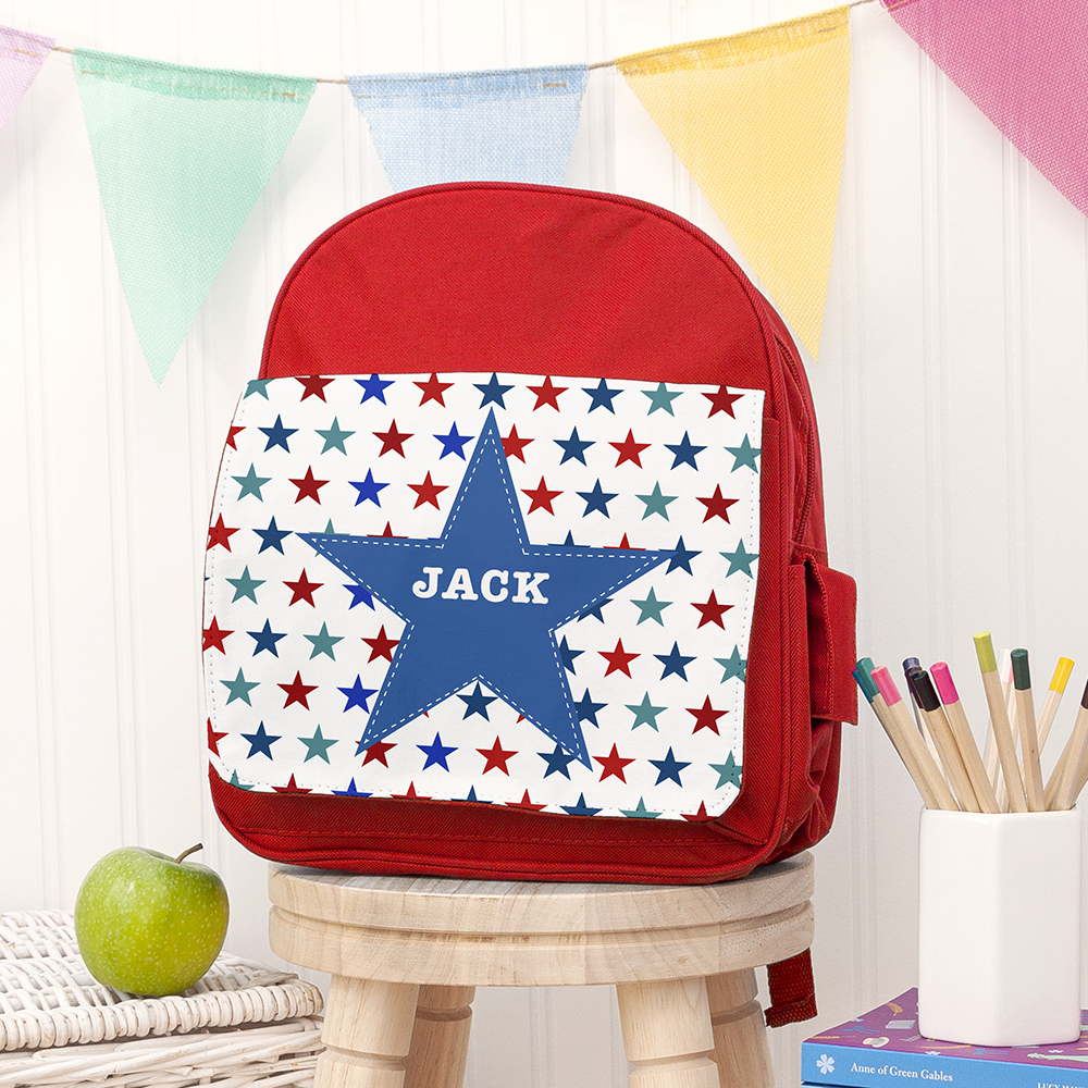 Personalised bright red mini rucksack with a multi-coloured star front pocket custom printed with the name Jack.