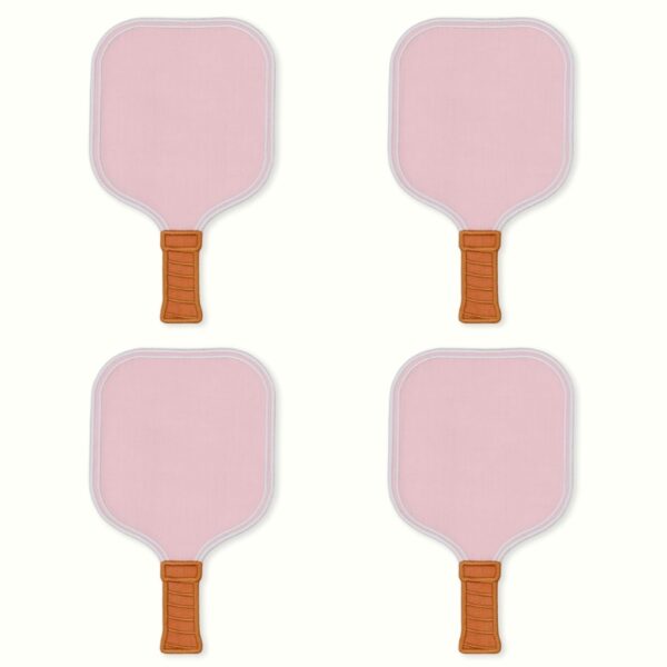 A set of four light pink linen cocktail napkins shaped like pickleball paddles, detailed with white embroidered borders and a light brown stitched handle grip.