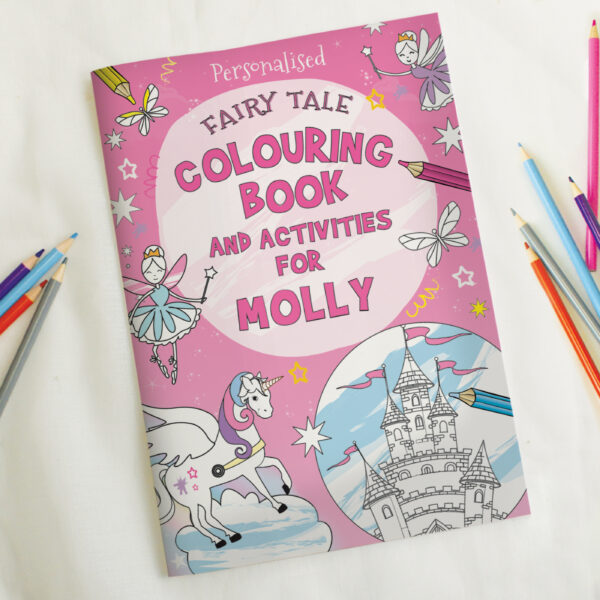 Personalised pink fairy tale colouring book for Molly featuring a unicorn and castle illustration alongside colouring pencils