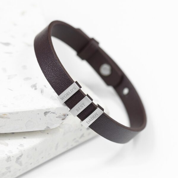 Personalised men's brown leather bracelet with three engraved silver tags reading WORLD'S BEST DADDY