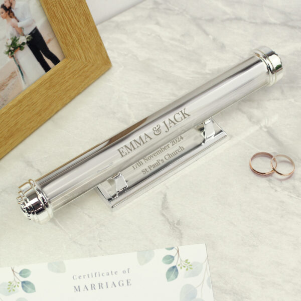 Personalised silver plated certificate holder engraved with couple's names on a display stand